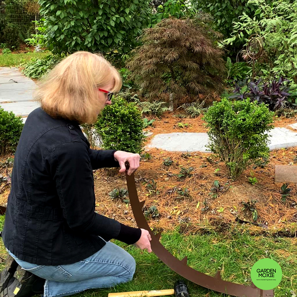 Sue Libertiny installing EverEdge landscape edging